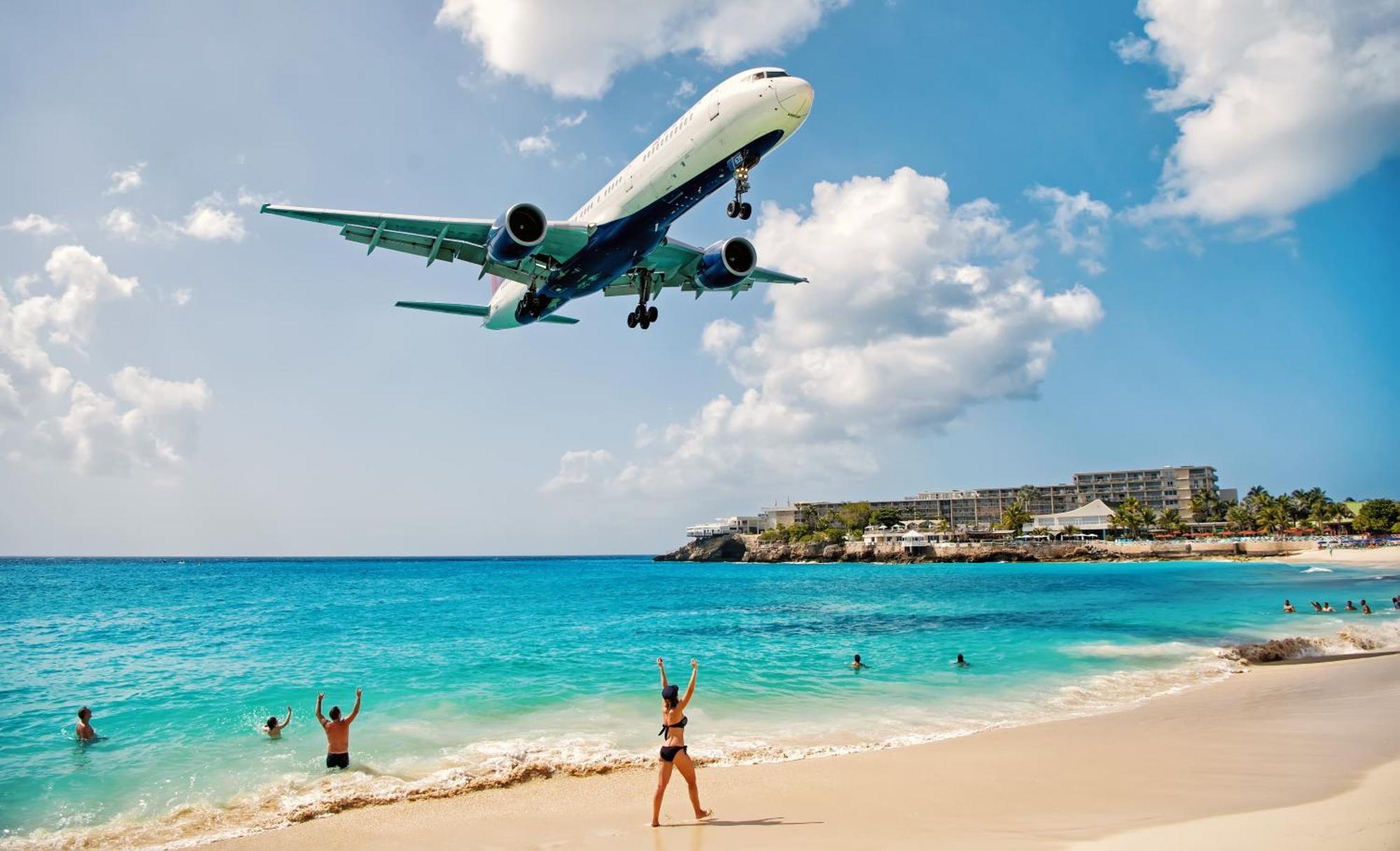 Simpson Bay Resort Marina & Spa Exterior photo A plane landing at Princess Juliana Airport